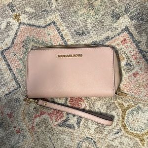 Michael Kors light pink wallet with wristlet strap